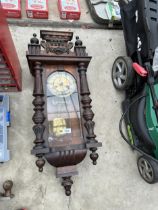 A VINTAGE WOODEN CASED WALL CLOCK