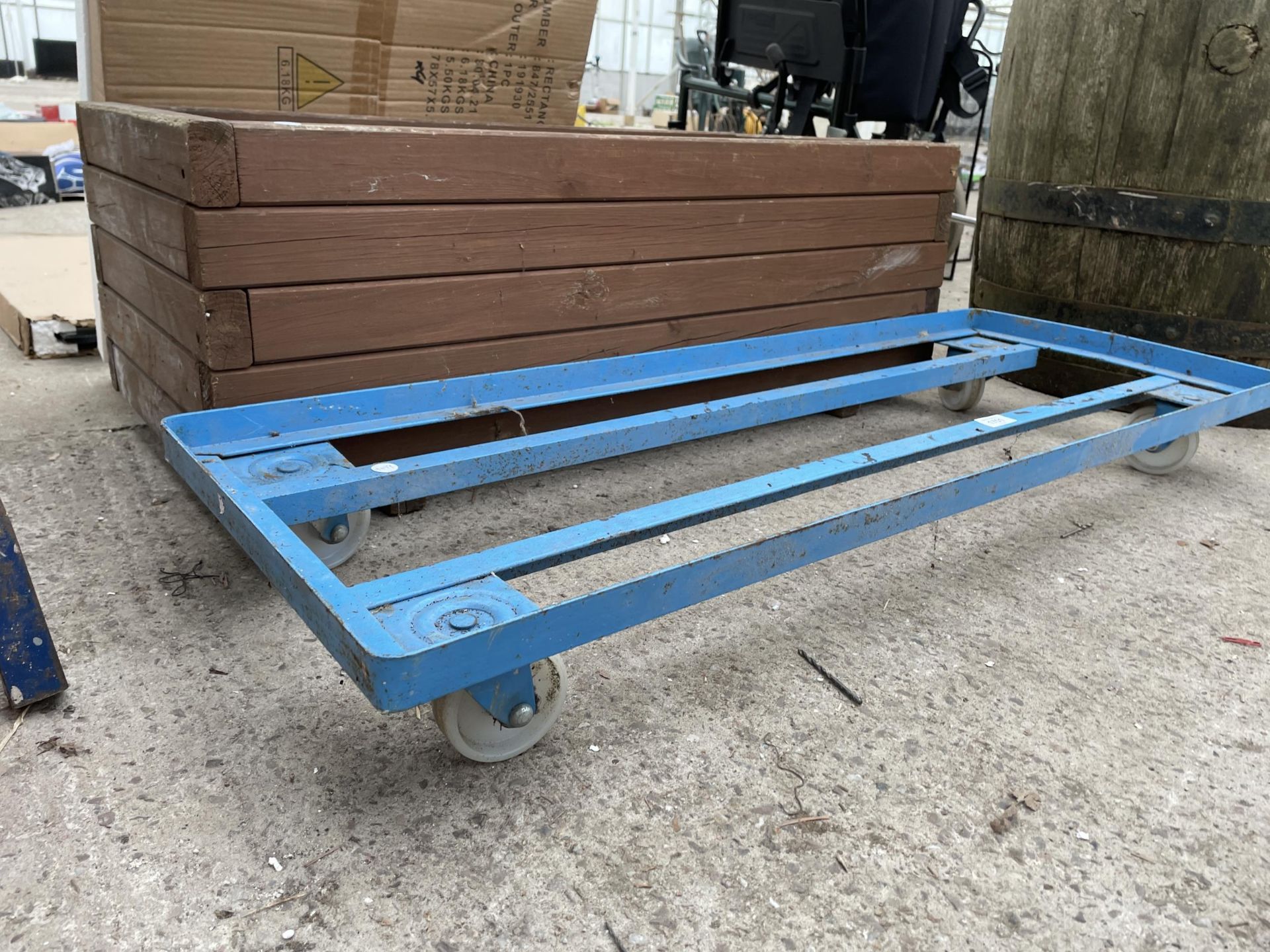 A METAL TROLLEY BASE AND A WOODEN TROUGH PLANTER - Image 2 of 2