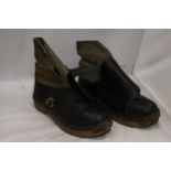A PAIR OF VINTAGE LEATHER AND WOODEN CLOGS