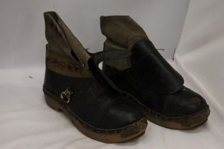 A PAIR OF VINTAGE LEATHER AND WOODEN CLOGS