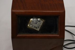 A ROTARY AUTOMATIC WRIST WATCH WITH SQUARE WHITE FACE, ROMAN NUMERALS AND A BLACK LEATHER STRAP