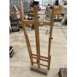 A WOODEN FOLDING ARTISTS EASEL