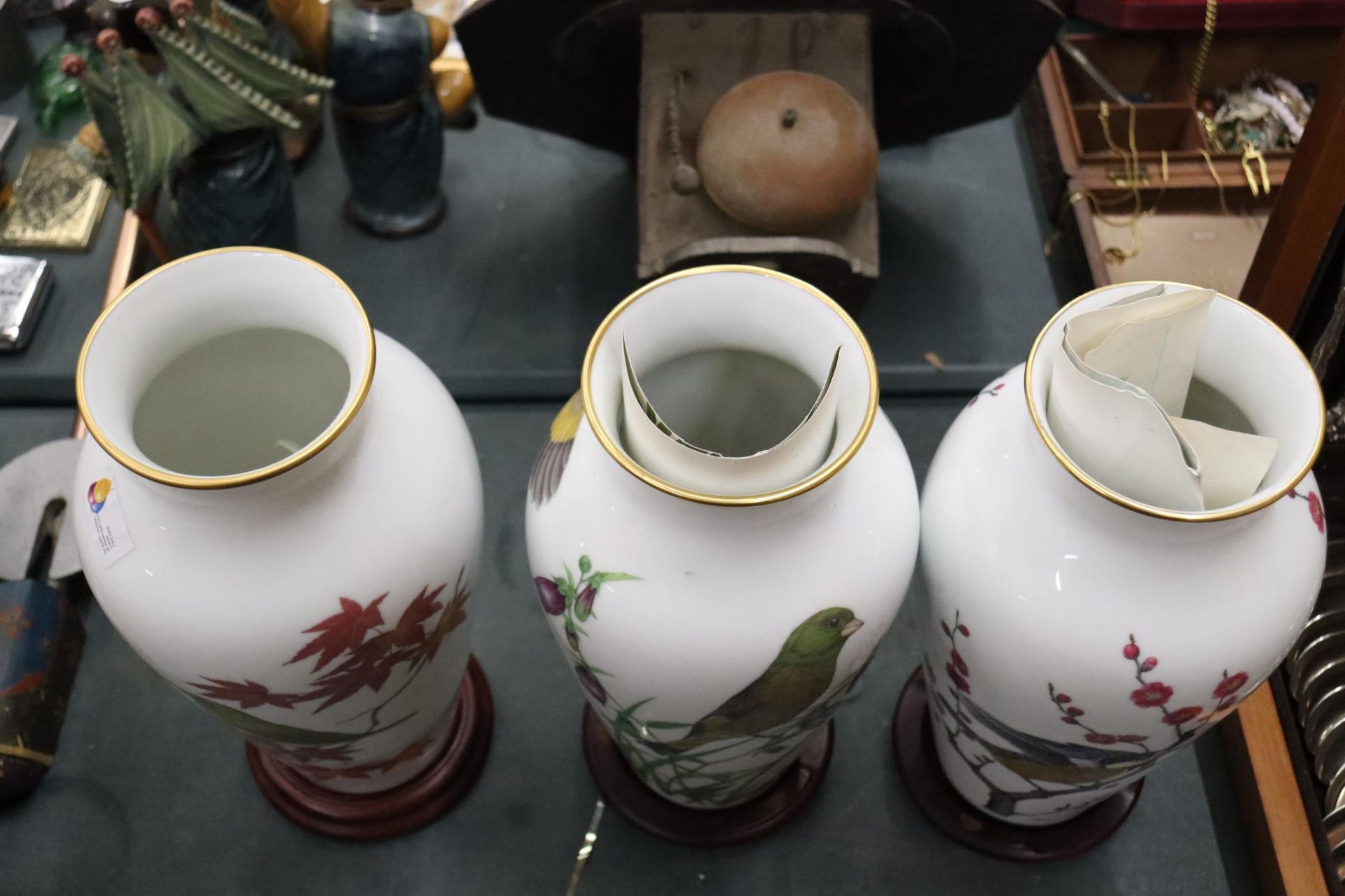 THREE LARGE FRANKLIN PORCELAIN VASES WITH JAPANESE CHARACTERS TO BASE AND WOODEN STANDS, THE HERALDS