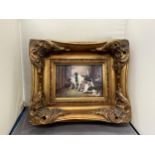A PRINT OF THREE DOGS IN A HEAVY GILDED FRAME PRINT SIZE 18CM X 12CM