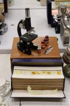 A VINTAGE LUNAX MICROSCOPE WITH A LARGE QUANTITY OF SLIDES IN A WOODEN BOX