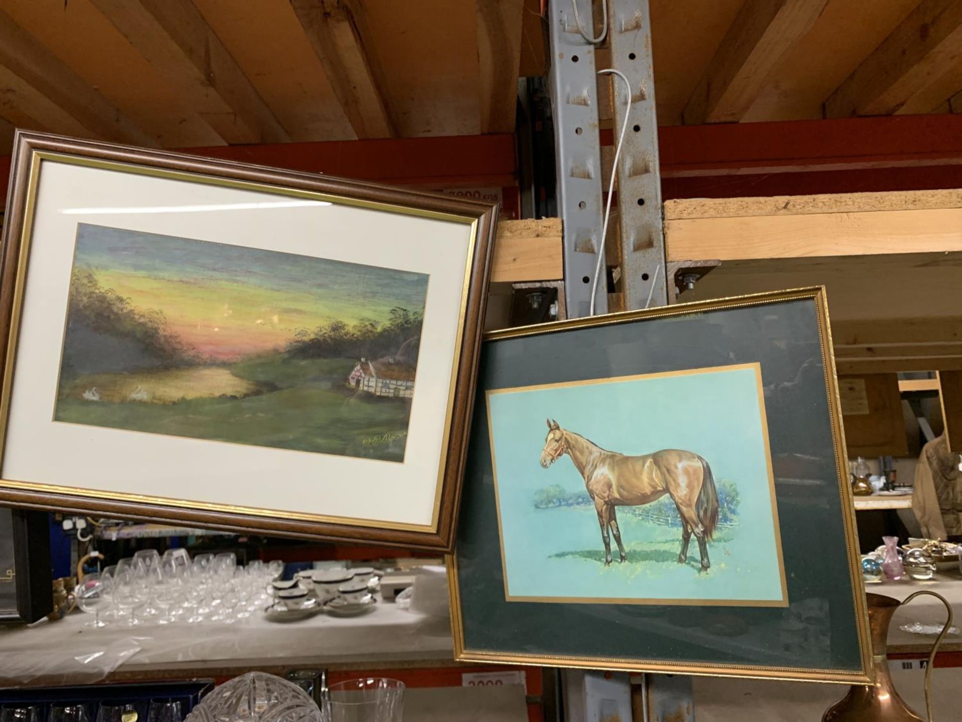 A PRINT OF A RACEHORSE PLUS A PAINTING OF A COTTAGE BY A RIVER AT SUNSET