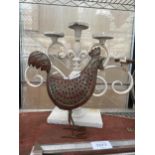 A DECORATIVE FIVE BRANCH CANDLESTICK AND A METAL CHICKEN