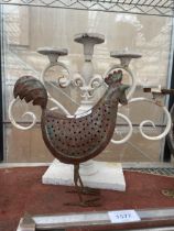 A DECORATIVE FIVE BRANCH CANDLESTICK AND A METAL CHICKEN