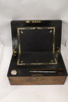 A BRASS BOUND WRITING BOX WITH SECRET DRAWERS, LEATHER TOOLED SLOPE WITH ONE INKWELL