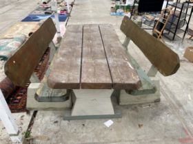 A LARGE RUSTIC HEAVY PLANK TOP GARDEN TABLE AND TWO MATCHING BENCHES