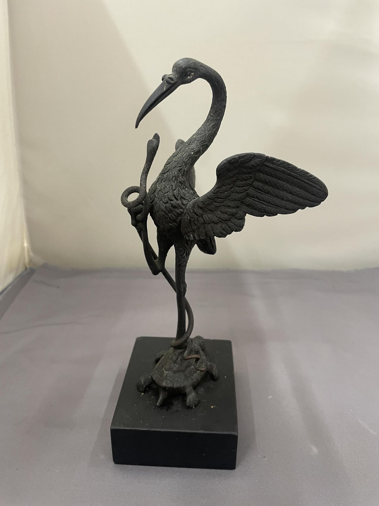 A BRONZE FIGURE OF THE TURTLE, STORK AND SNAKE ON A BASE