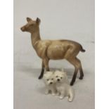 A PAIR OF BESWICK SITTING WEST HIGHLAND TERRIERS TOGETHER WITH A BESWICK DEER FIGURE (A/F)