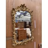 A 19TH CENTURY STYLE GILT FRAMED WALL MIRROR WITH ACORN DECORATION TO RIM, 36" X 21"