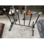 A VINTAGE WROUGHT IRON WELLY STAND WITH CERAMIC KNOBS