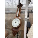 AN OAK CASED WALL BAROMETER