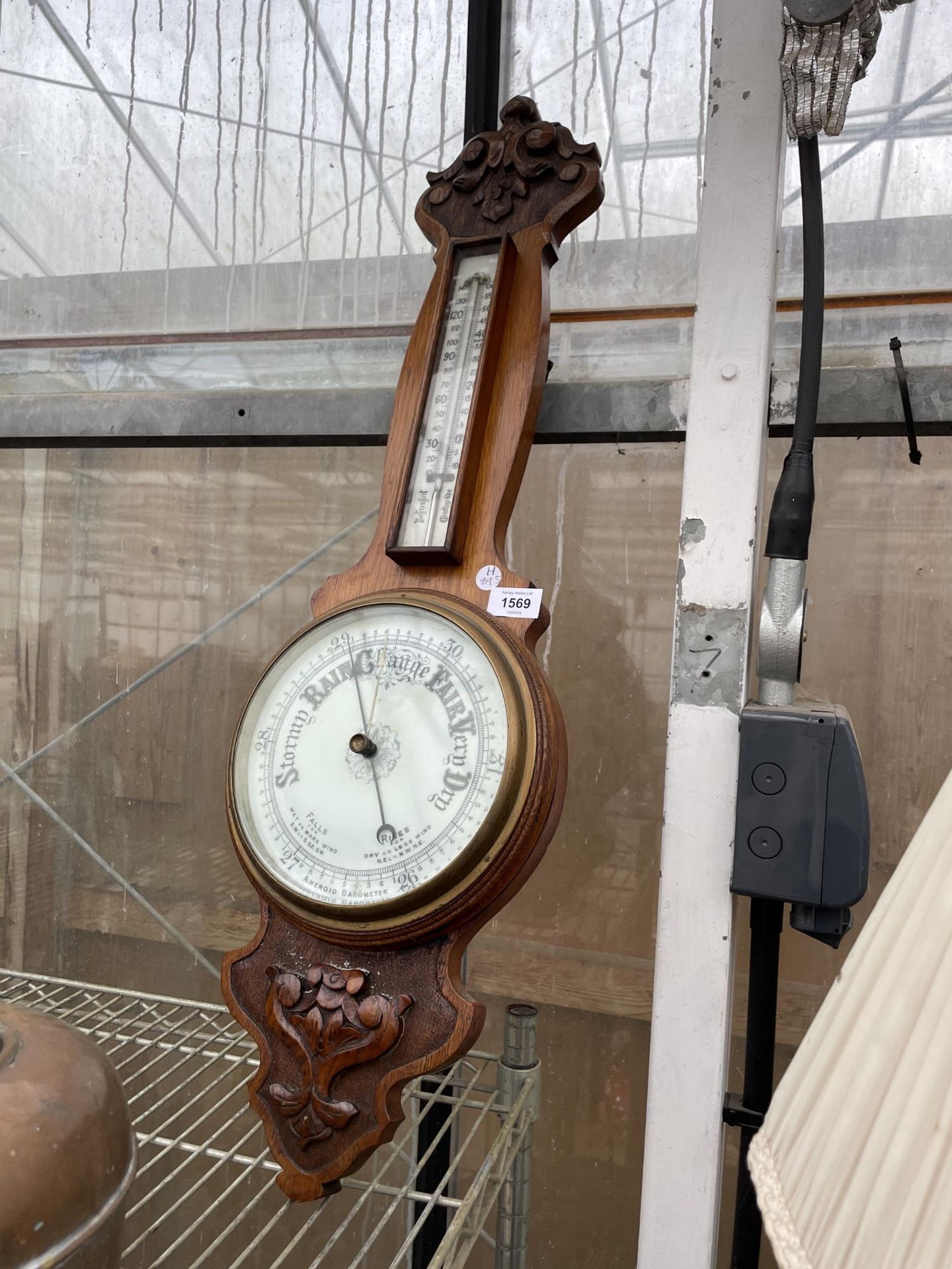 AN OAK CASED WALL BAROMETER