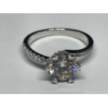 A MARKED 9K RING SET WITH A 1 CARAT OF MOISSANITE AS A SOLITAIRE AND CHIPS TO SHOULDERS SIZE I