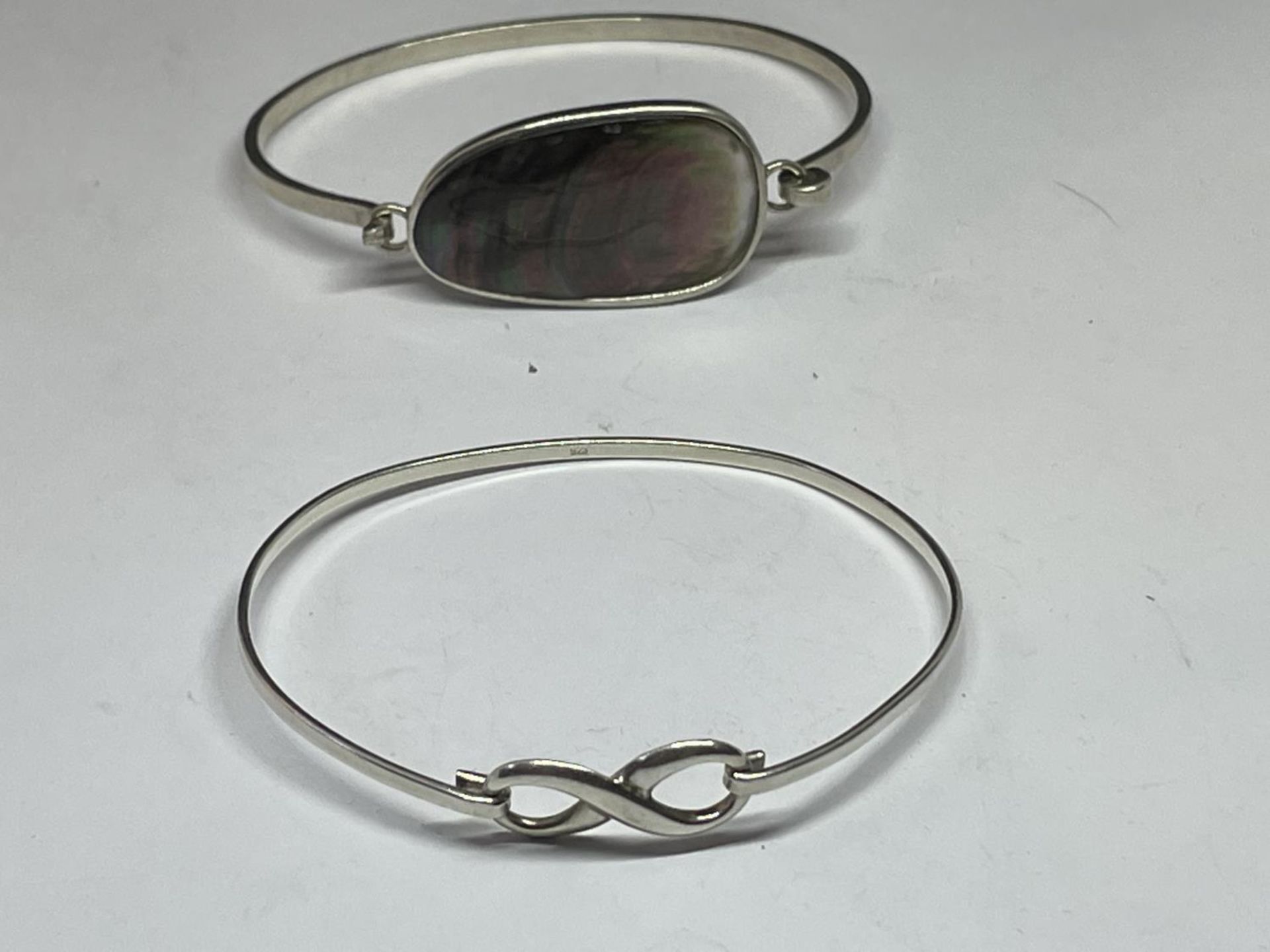 TWO SILVER BANGLES