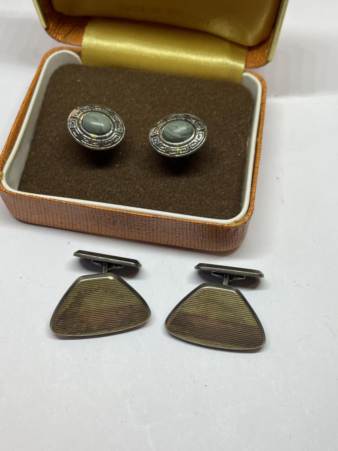 TWO PAIRS OF SILVER CUFFLINKS IN A PRESENTATION BOX