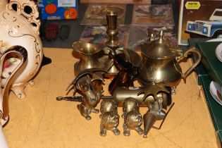 A COLLECTION OF BRASSWARE TO INCLUDE A LARGE 'WEE WILLIE WINKIE' CANDLESTICK, A TEAPOT, JUGS,