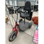 A VELECO THREE WHEELED MOBILITY SCOOTER WITH KEY AND CHARGER IN THE OFFICE