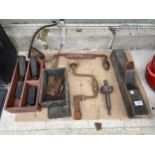 AN ASSORTMENT OF VINTAGE TOOLS TO INCLUDE BSA MOTORBIKE PEGS, A BRACE DRILL AND A WOOD PLANE ETC