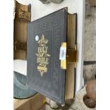 A VINTAGE LEATHER BOUND BIBLE WITH BRASS DETAIL