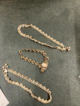 THREE ASIAN SILVER ITEMS TO INCLUDE A BRACELET AND TWO ANKLETS