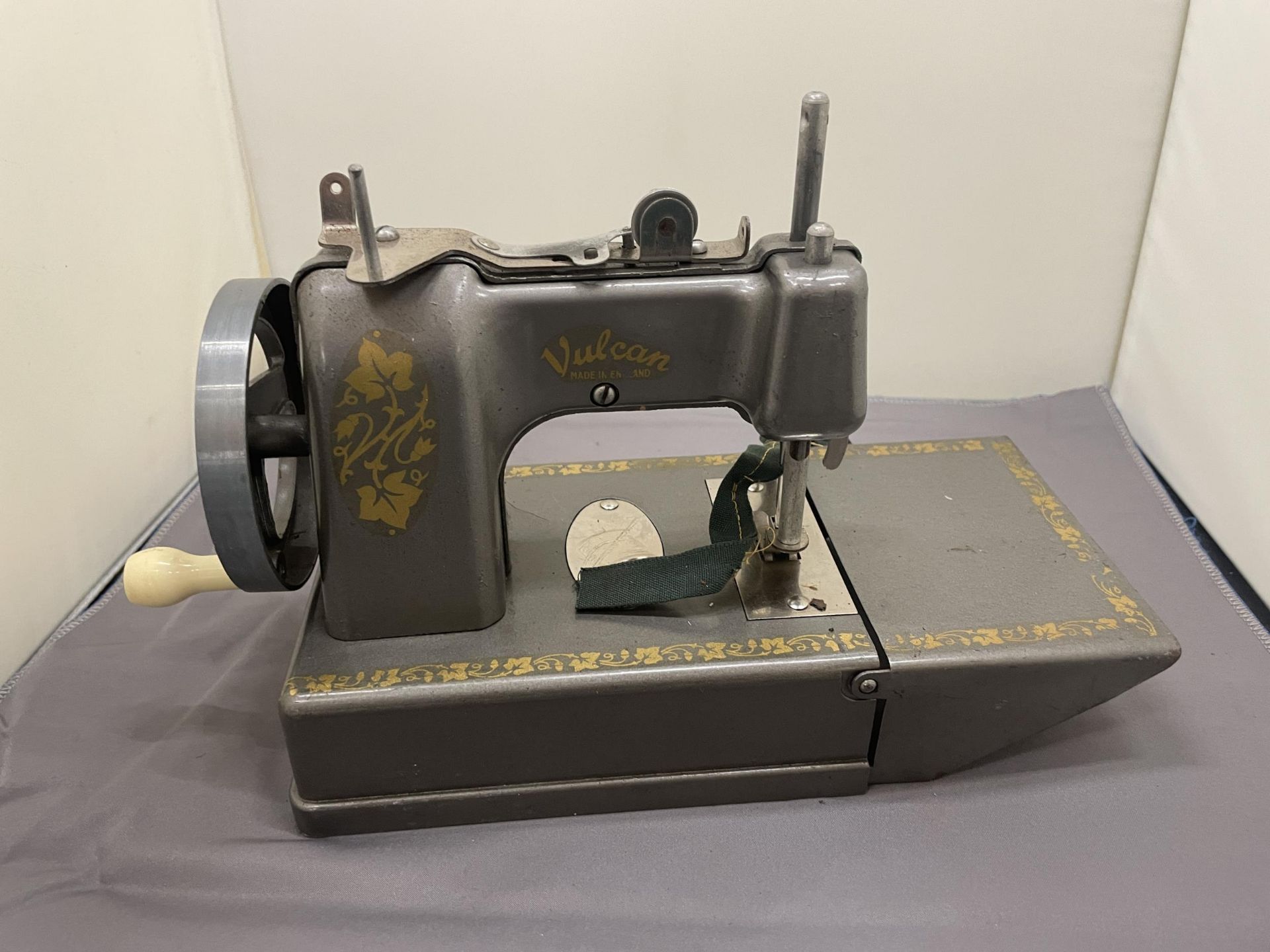 A VINTAGE VULCAN SMALL SEWING MACHINE