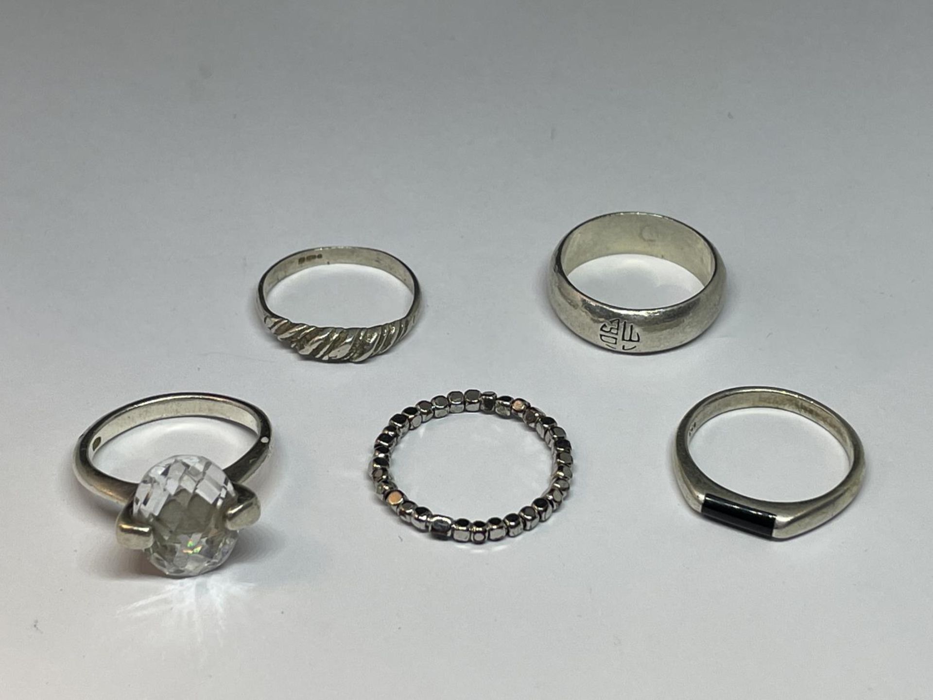 FIVE SILVER RINGS