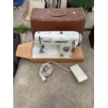 A PERFEX ELECTRIC SEWING MACHINE WITH CARRY CASE AND FOOT PEDAL