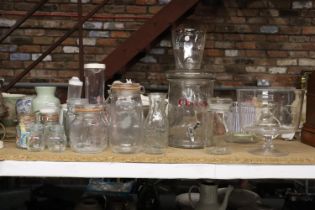 A QUANTITY OF GLASS KITCHEN ITEMS TO INCLUDE STORAGE JARS, VASE, FRUIT BOWL, ETC.,