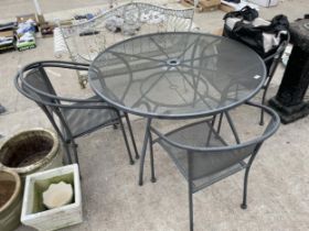 A METAL PATIO FURNITURE SET COMPRISING OF A ROUND TABLE AND FOUR CHAIRS WITH CUSHIONS