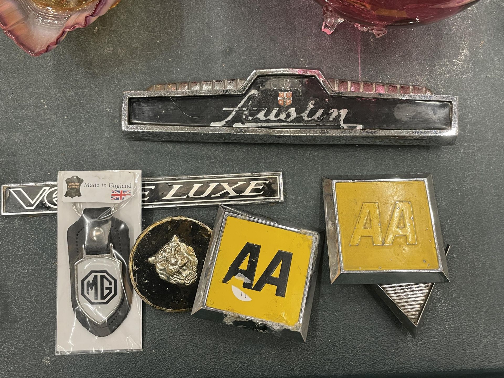 SEVEN VINTAGE CAR BADGES TO INCLUDE THE AA, AUSTIN, ETC