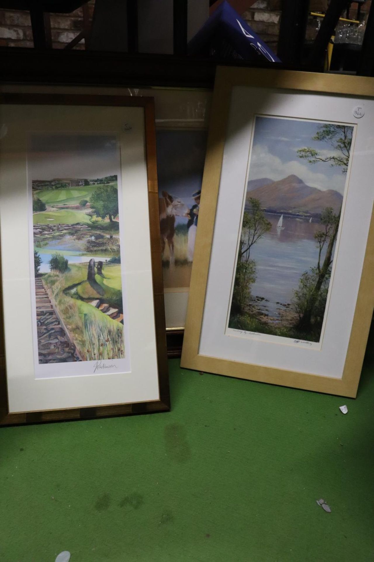 THREE FRAMED PRINTS TO INCLUDE A CALF WITH YOUNG GIRLS, A LAKE AND MOUNTAINS, ETC