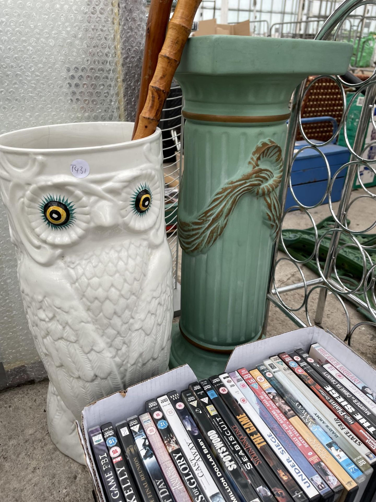 AN ASSORTMENT OF ITEMS TO INCLUDE DVDS, A DVD RACK, AN OWL CERAMIC STICK STAND AND A JARDINAIRE - Image 5 of 5