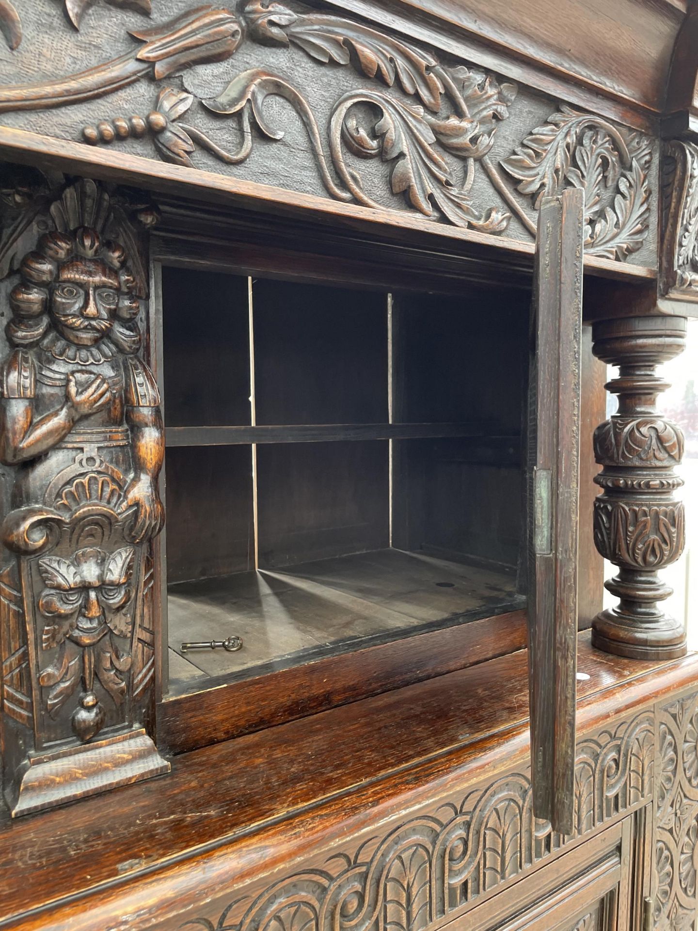 AN OAK GEORGE III STYLE COURT CUPBOARD WITH CARVED PANELS, THREE DEPICTING THE BIRTH AND CRUCIFIXION - Image 10 of 12