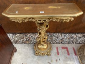 A GILT EFFECT CONSOLE TABLE ON PUTTI PEDESTAL WITH CLAW FEET