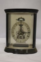 A DAVID PETERSON STYLE OVAL GLASS AND MAHOGANY SKELETON CLOCK WITH PASSING STRIKE MOVEMENT HEIGHT