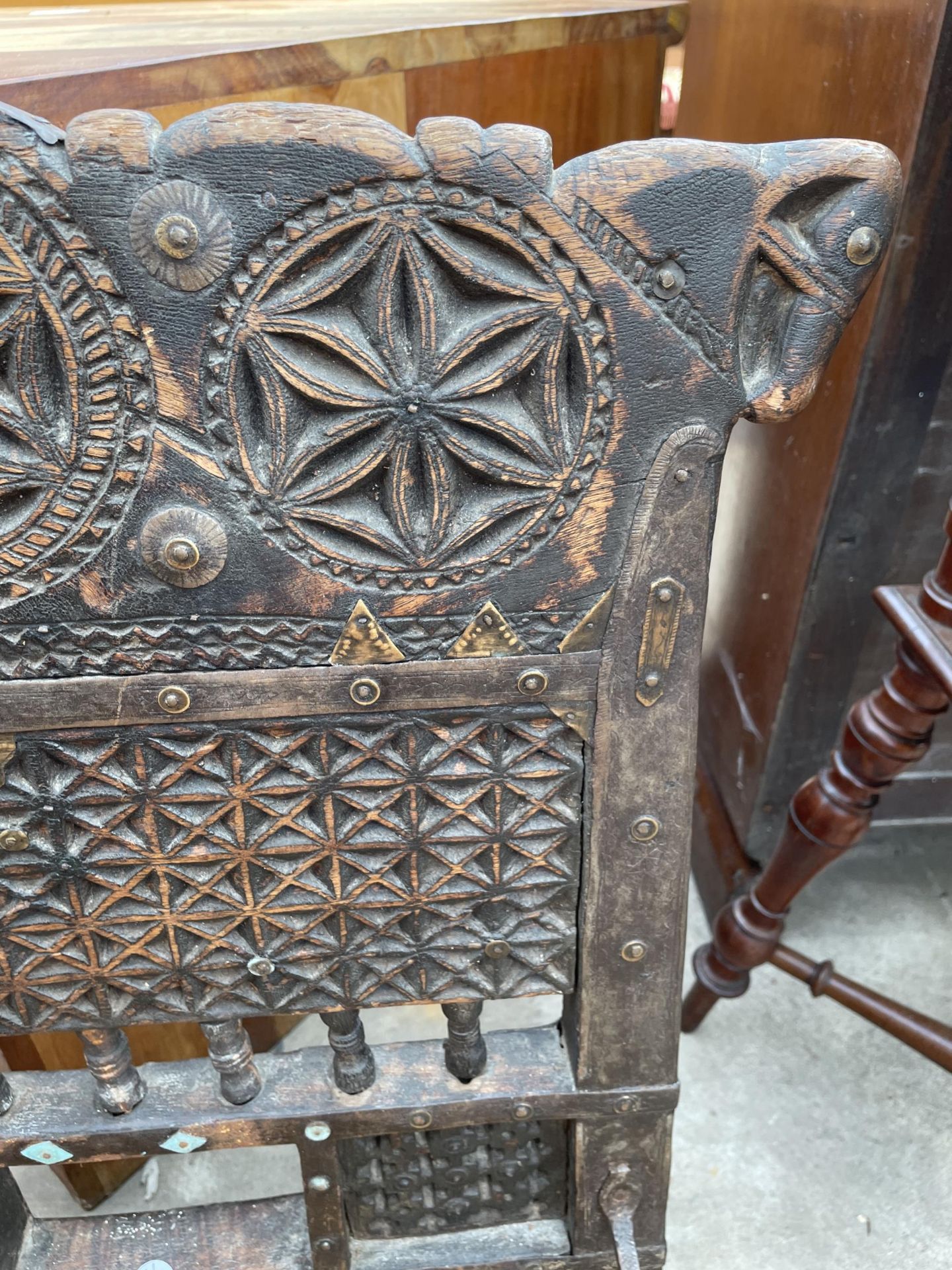 AN INDIAN TRIBAL LOW CHAIR WITH CARVED BACK AND WOVEN SEAT - Image 6 of 6