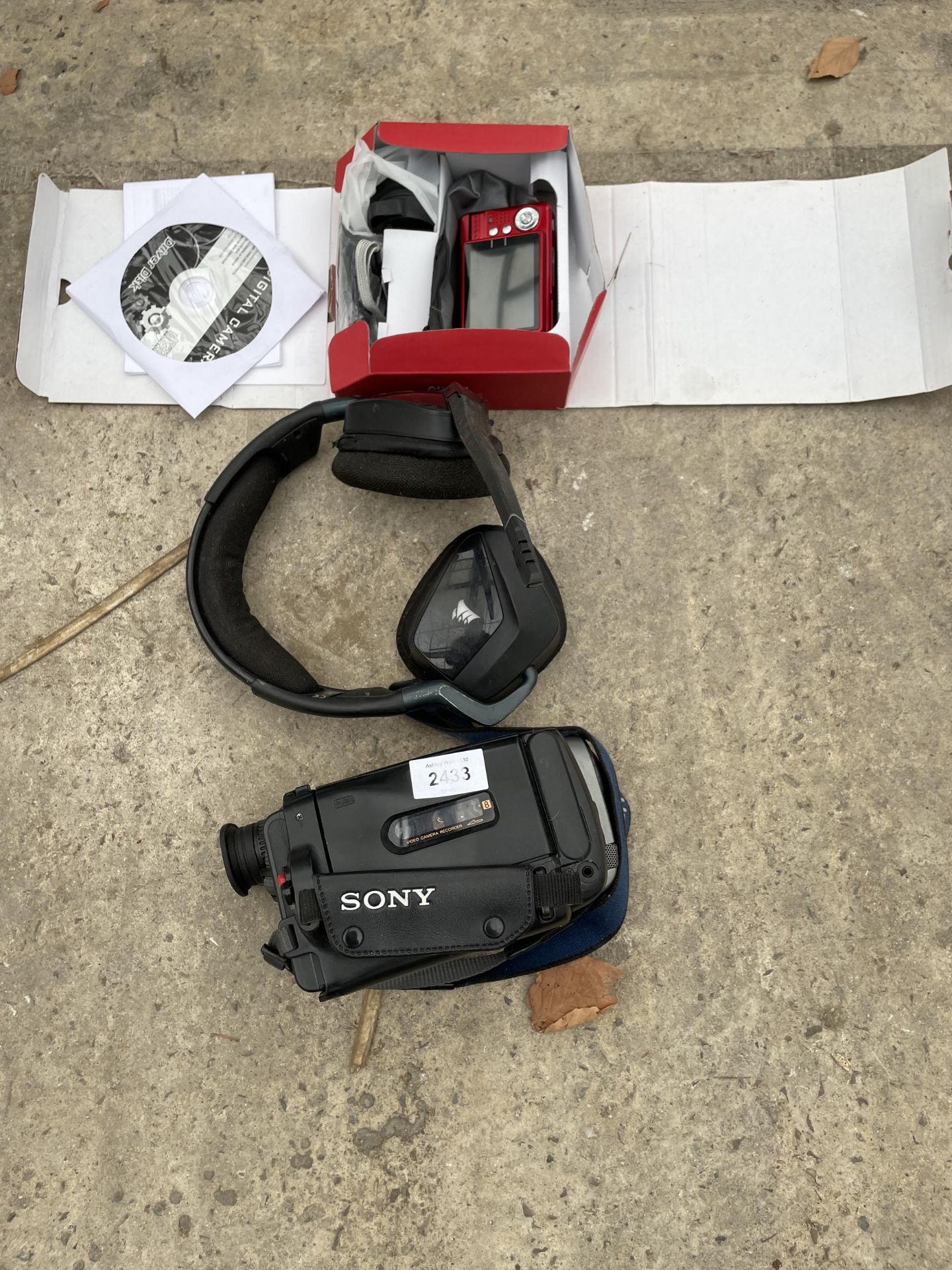 A SONY CAMCORDER, A HEADSET AND A DIGITAL CAMERA