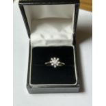 A 9CT YELLOW GOLD DAISY DESIGN RING, WITH CUBIC ZIRCONIAS, SIZE J 1/2 COMPLETE WITH PRESENTATION BOX