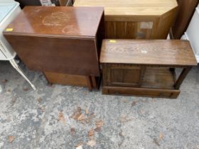A MID 20TH CENTURY SMALL OAK TWO TIER TABLE WITH PULL THROUGH DRAWER AND CUPBOARD 28" WIDE, AND A
