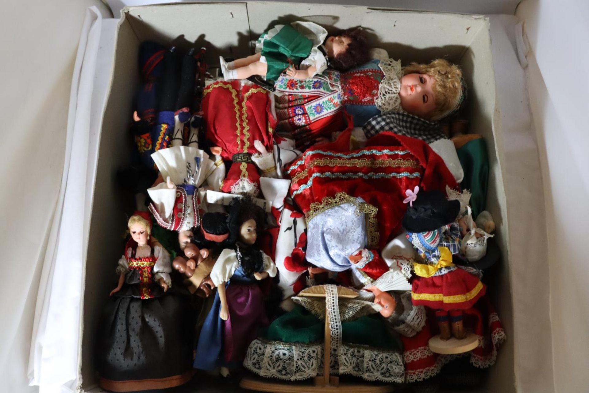 A LARGE COLLECTION OF DOLLS FROM AROUND THE WORLD