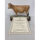 A ROYAL WORCESTER MODEL OF A JERSEY COW MODELLED BY DORIS LINDNER AND PRODUCED IN A LIMITED