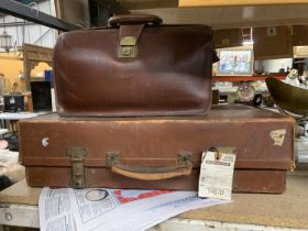 A VINTAGE LEATHER SUITCASE WITH A CANADIAN PACIFIC RAILWAY LABEL PLUS A VINTAGE LEATHER BRIEFCASE