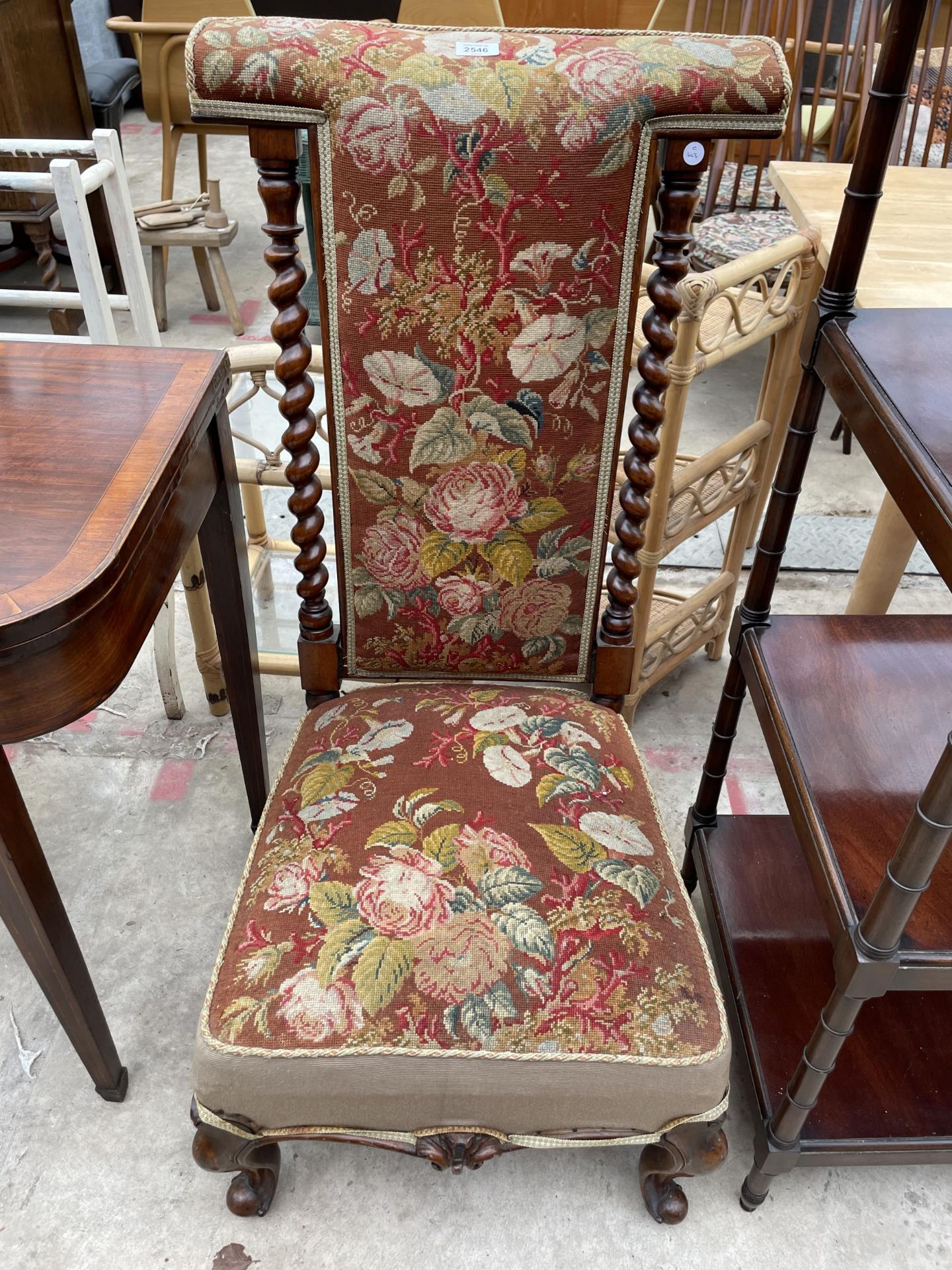 A VICTORIAN MAHOGANY PRIE DEU CHAIR WITH BARLEY TWIST UPRIGHTS AND WOOLWORK SEAT AND BACKS