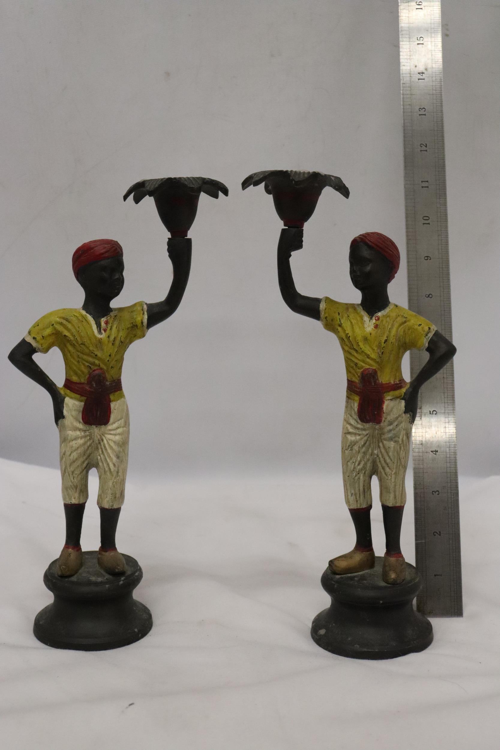 A PAIR OF 19TH CENTURY AUSTRIAN COLD PAINTED BRONZE BLACK A MOOR BOYS CANDLESTICKS