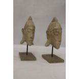 TWO BUDDAH HEADS ON STANDS, HEIGHT 27CM