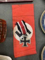 A REPRODUCTION GERMAN ARMBAND AND MEDAL